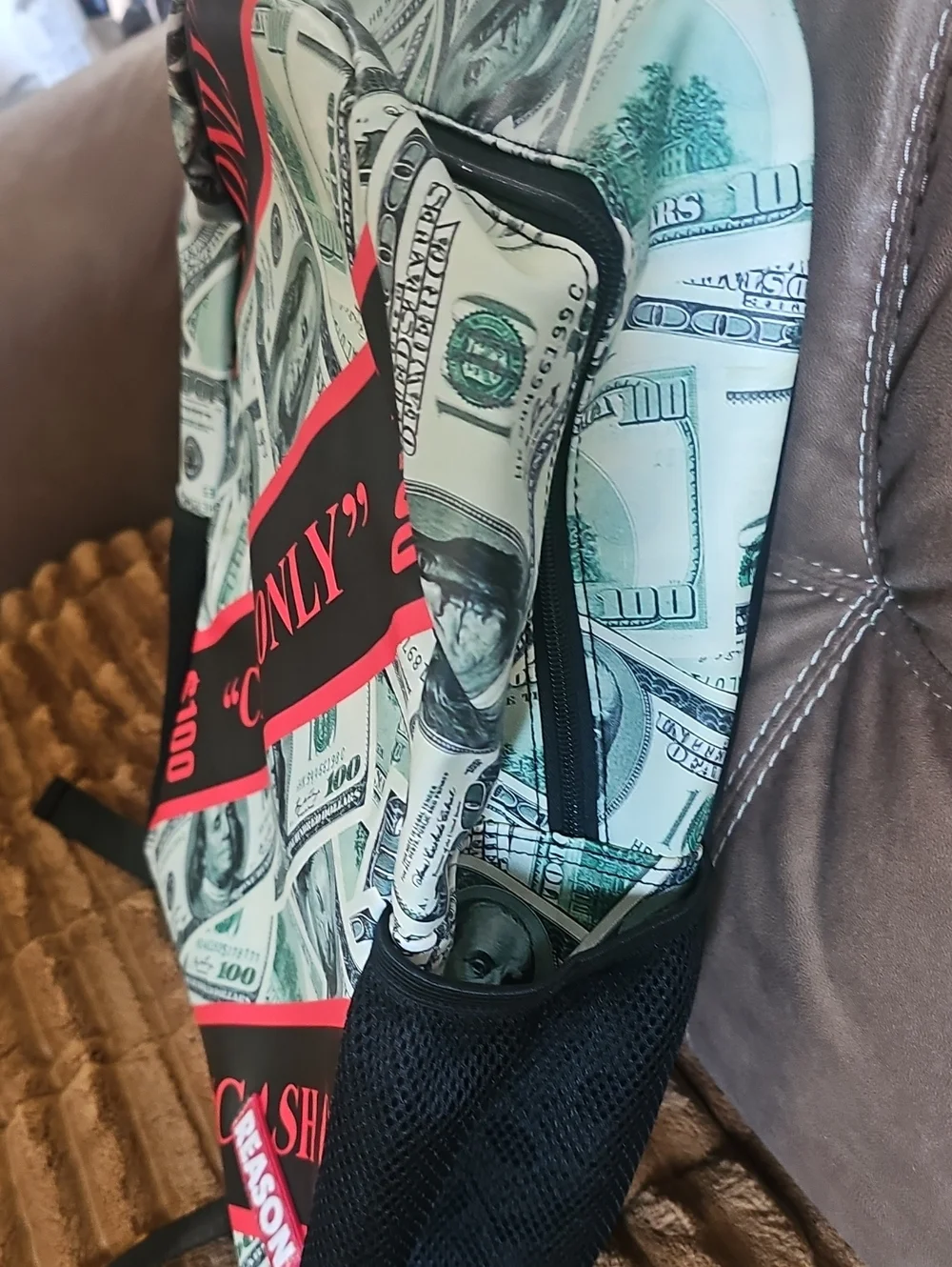 Reason Cash-Print Backpack in Green and Black with Pink Accent